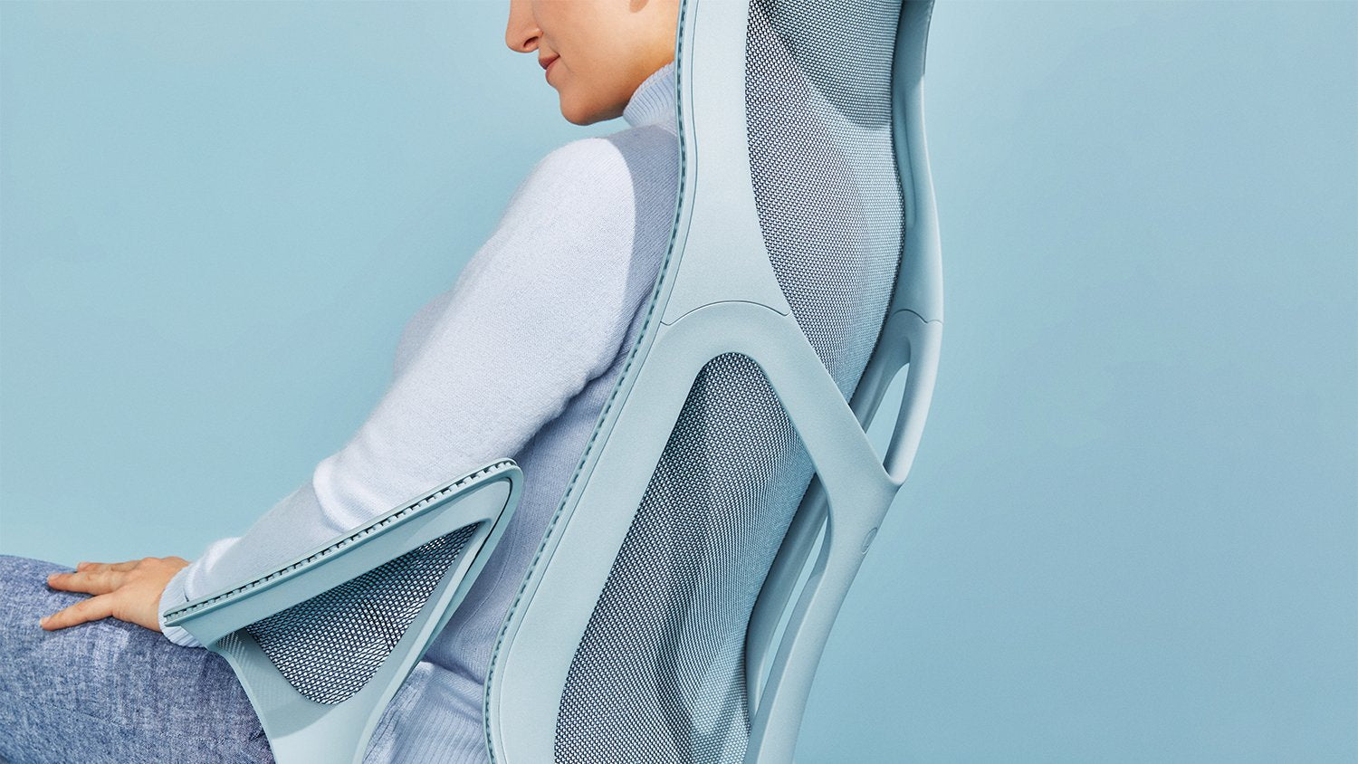 Someone sitting in a Herman Miller Cosm